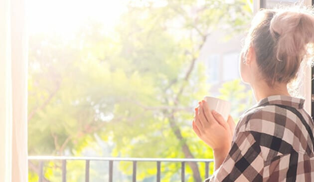 Woman looking outside