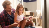 Dad with Daughter Reading