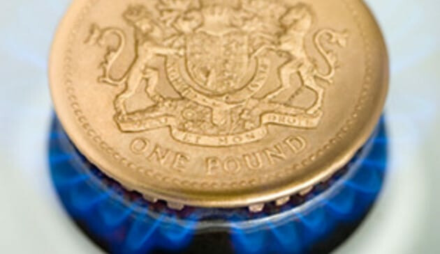 pound coin on a gas ring