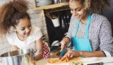 Mother and daughter cooking
