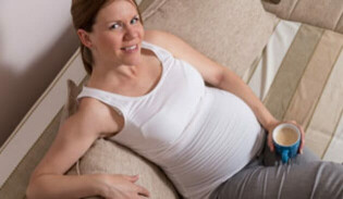 Pregnant woman drinking tea