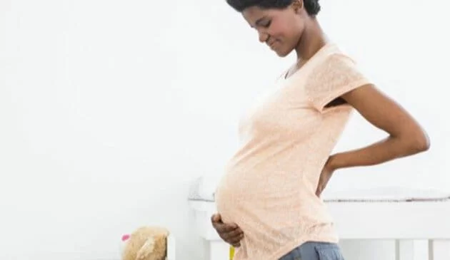 Woman touch pregnancy bump