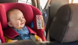 Happy baby in car seat