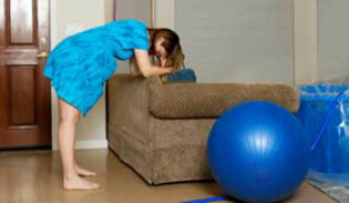 Woman having a home birth