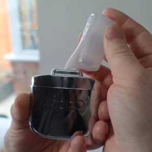 Zippo 12-Hour Refillable Hand Warmer being refuelled