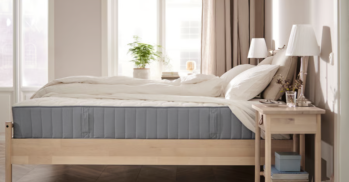 An IKEA mattress in a light-filled bedroom